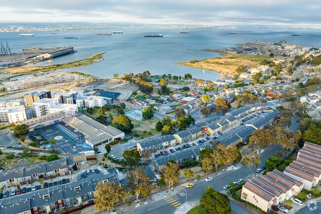 Commercial shipping vessels park just off the coast of Hunter’s Point.