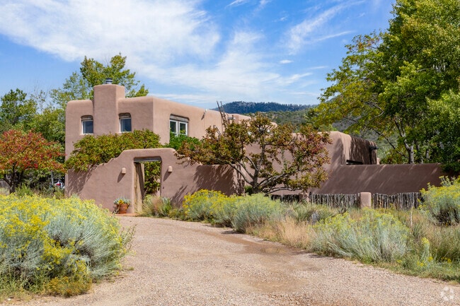 Large Santa Fe style homes at the foot of mountains fetch a pretty penny in Southeast.