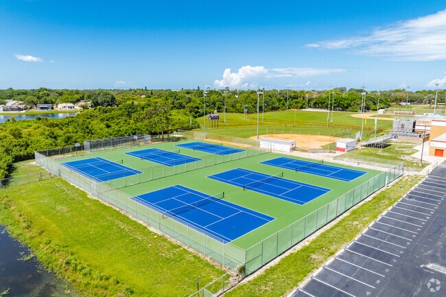 Students enjoy outdoor play on the sports courts at Tarpon Springs High School.