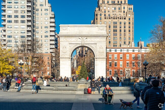 The iconic Washington Square Arch towers over the park’s north end.