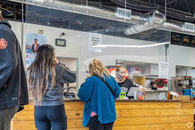 Residents of Long Beach, MS flock to Long Beach Market for food and groceries.