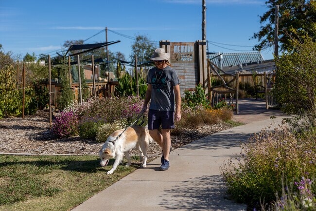 Locals enjoy walking their dogs at Will Rogers Gardens.
