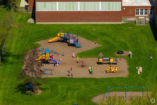 Children come to the playground to play at Elbridge Elementary.