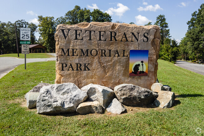 The name of the park carved into a stone in Memorial Park.