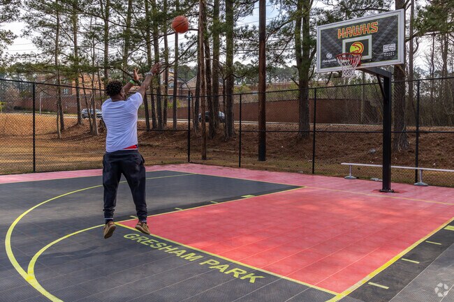 Stop by Gresham Park's Hawks theme basketball court for a pick up game.
