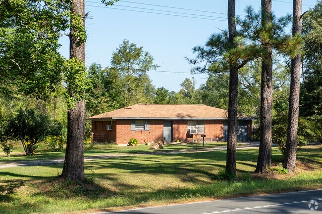 Many of the homes in Starks are surrounded by tall pines.