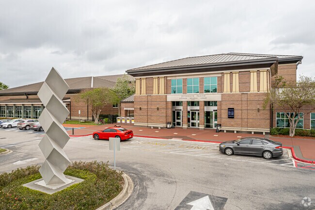 A sculpture stands in front of the main entrance to the Jefferson Parish East Bank Regional Library in the Clearview Estates neighborhood