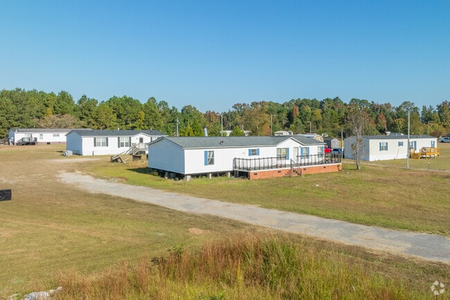 Clusters of manufactured homes sit off of narrow roads in Lydia.