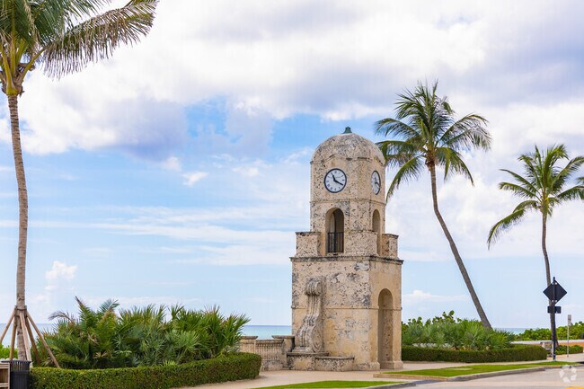 The iconic Palm Beach clock tower stands tall, a beloved landmark enjoyed by South End locals.