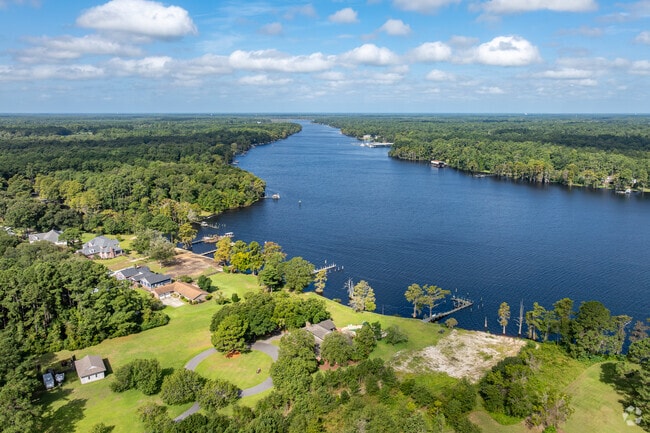 Custom-built homes on Brice’s Creek are nestled on spacious wooded lots.