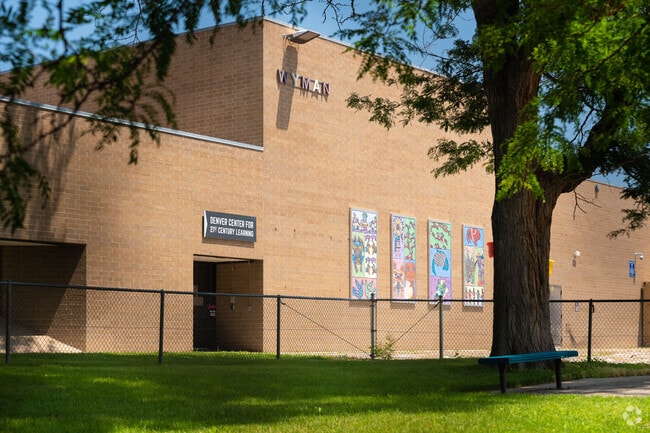 Denver Center for 21st Century Learning displays artwork on the side of the building.