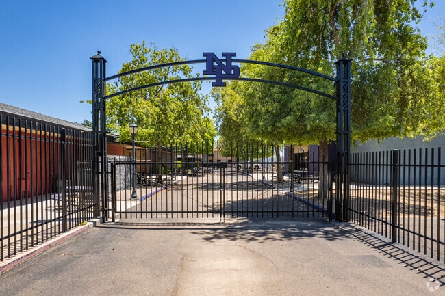 The gate with the NP logo greets you at Heritage Academy Pointe JH/HS in Phoenix.