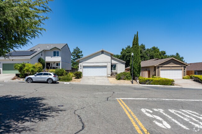 A typical street view in Foxboro includes traditional and split-level homes.