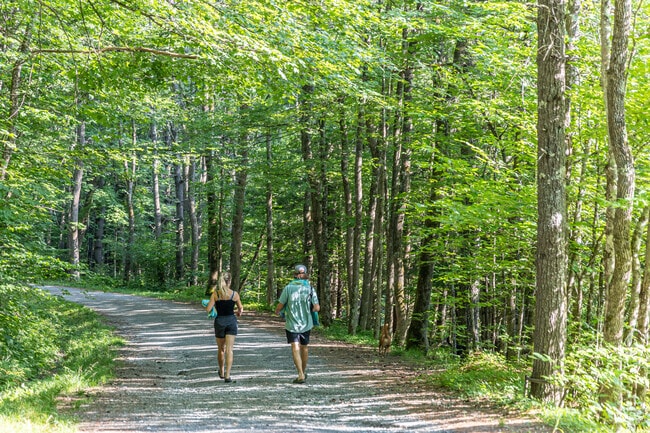 Residents enjoy a walk along the Ompompanoosuc River in Strafford.
