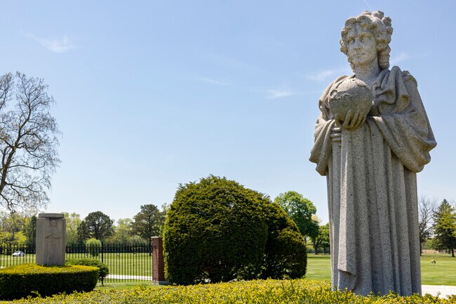 West Grand Ave features a graveyard with reflective statues to commemorate those who have passed.