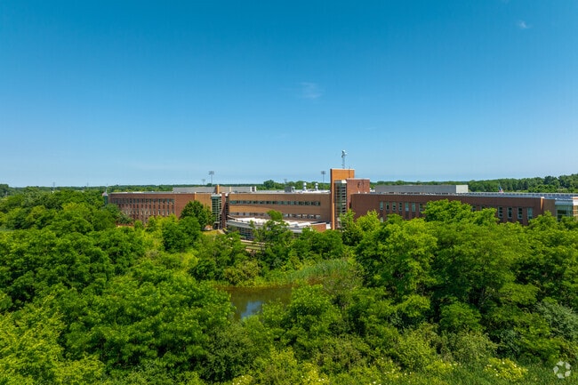 Grayslake North High School is surrounded by trees and vegetation.