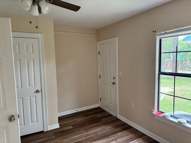 Master Bedroom with back door to yard