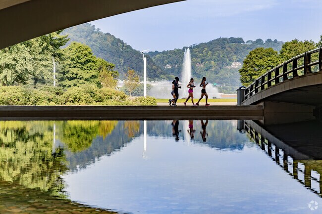 Friends run on the paths at the beautiful Point State Park.