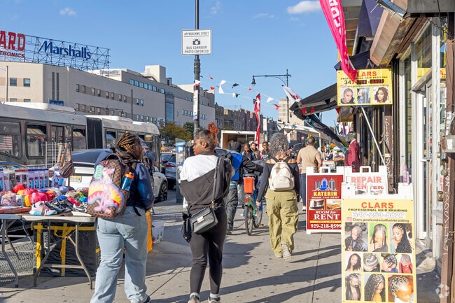 Local Fordham Manor residents visiting some of the local vendors and shops in the neighborhood.