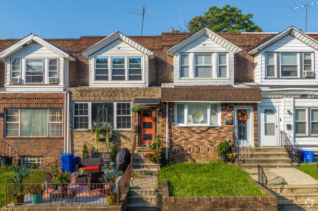 Rowhomes in Penrose often include small patios or yards ideal for gardening.