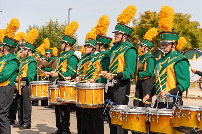 The NDSU Marching band performs at a tailgate in the Fargodome parking lot near Westgate.