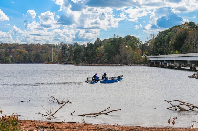 Find people cruising by and various types of boat on the waters of Lake District.