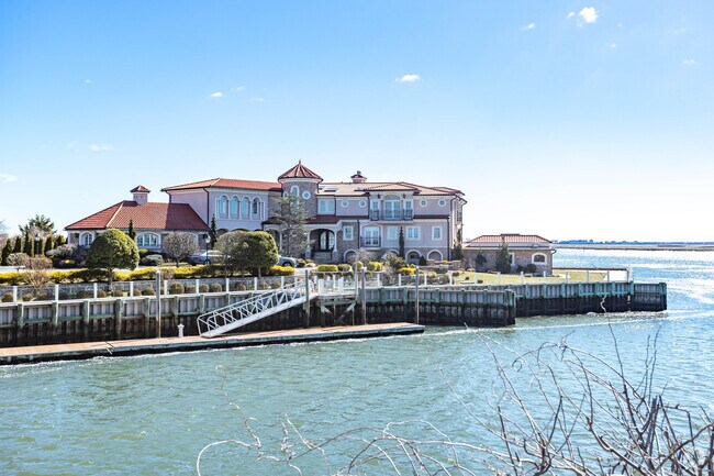 Huge luxury waterfront homes line the shores of Hewlett Harbor, New York.