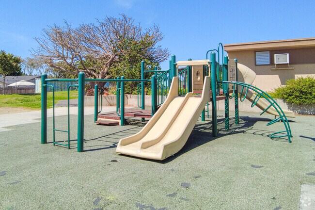 Playground area with swings to the right.