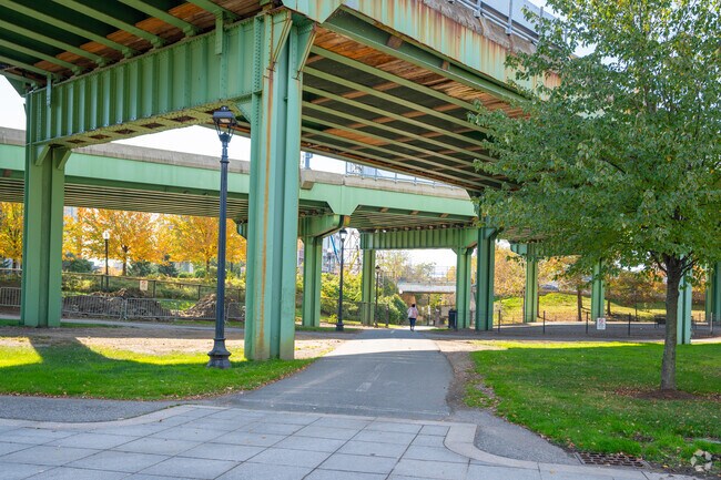 Enjoy the long paved path through the East Boston green space near Central Maverick Square.