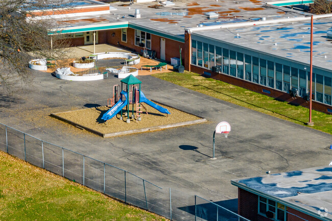 Evergreen Elementary School include a colorful playground and outdoor area for students.