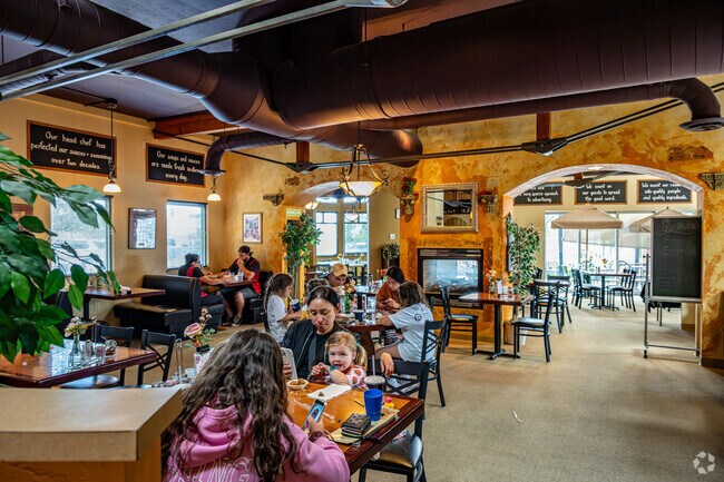 Patrons savor authentic Italian cuisine at Romeo's, crafted with fresh, local ingredients.