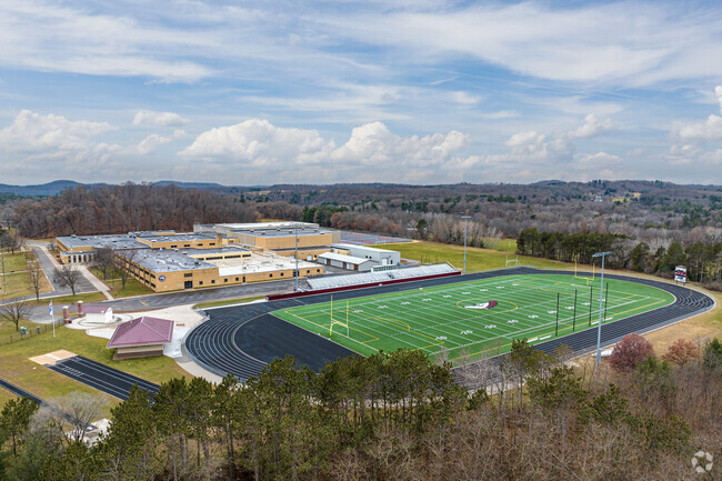 The athletics stadium is on the north side of Menomonie High School.