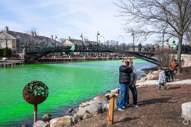 Wonderview residents snap photos of the Fox River Dyeing in McHenry.