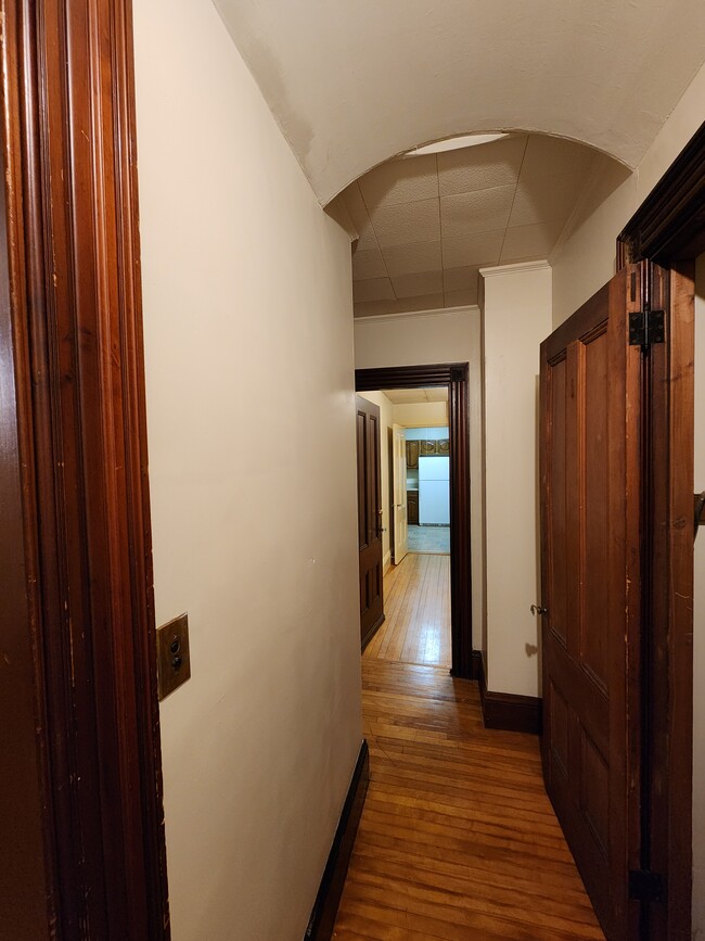 Hallway next to Bedroom 1, looking into the kitchen