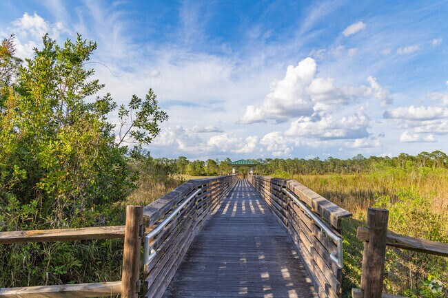 The Royal Palm Beach Pines Natural Area offers serenity and ample trails for locals to enjoy.