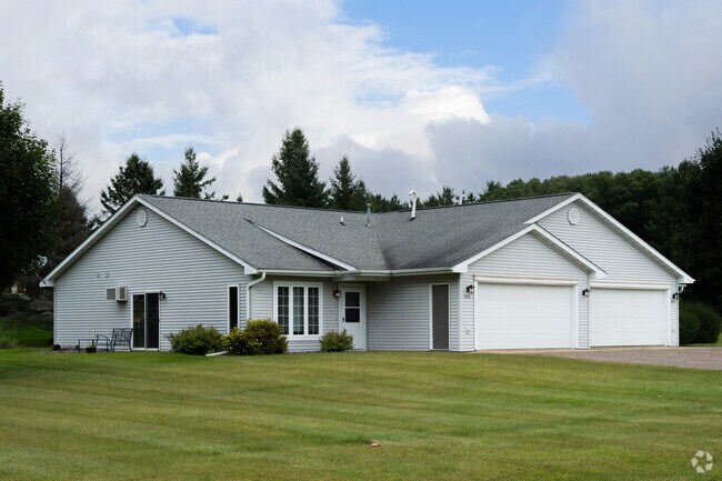 Homes with manicured front lawns are a common sight in Tainter Lake.