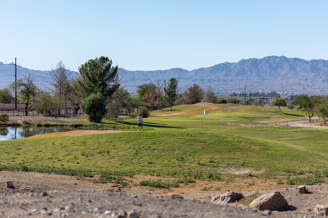 Los Lagos Golf Club features a scenic 18-hole course with lush fairways, challenging greens, and stunning desert views.