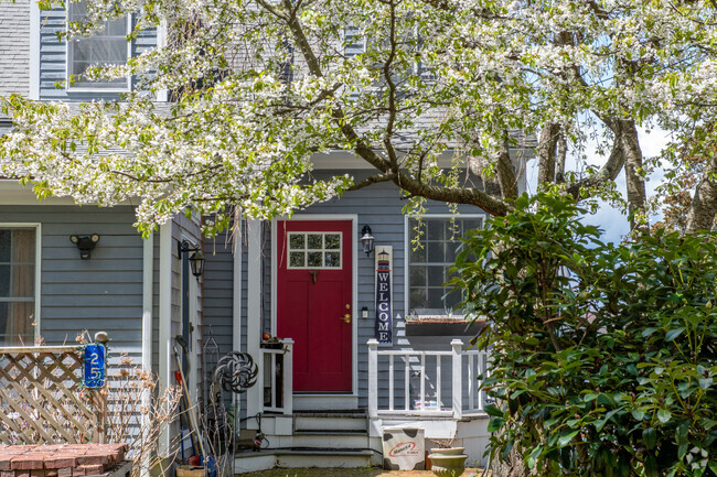 A flowering tree by the door is quite welcoming in the Touisset Highlands neighborhood.