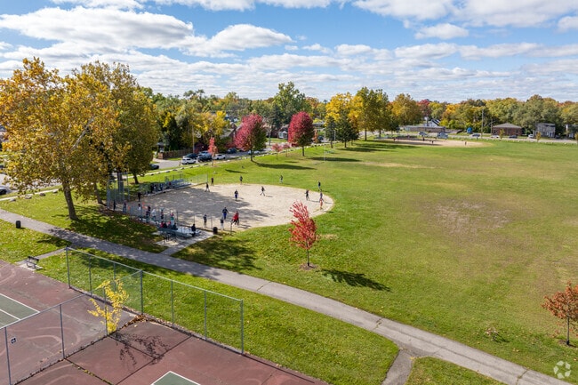 A group of people playing kickball at Peterson Playfield in the Hubbell-Puritan neighborhood.