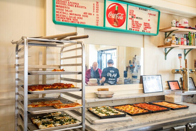 Baby Luc's Pizza offers whole pizza pies or slices.