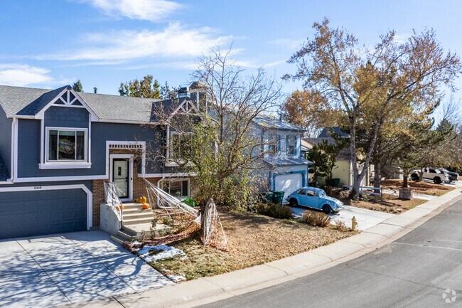 A row of colorful two-story homes in Broomfield's Columbine Meadows neighborhood.