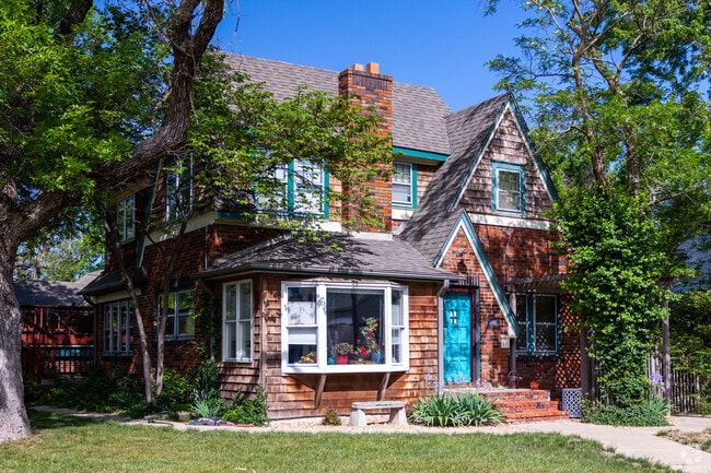 Red brick home with A-frame roof in MacDonald.