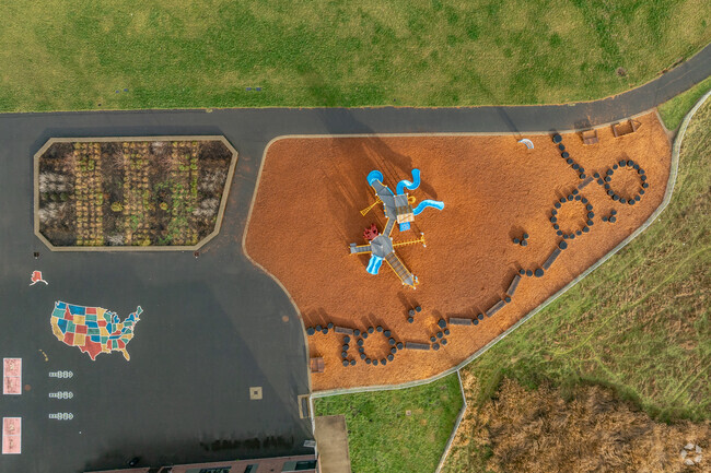 Garden boxes and a balance course are features of the Image Elementary School playground.