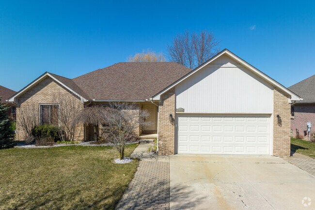 Locals of Macomb Township enjoy neatly trimmed lawns with large driveways.