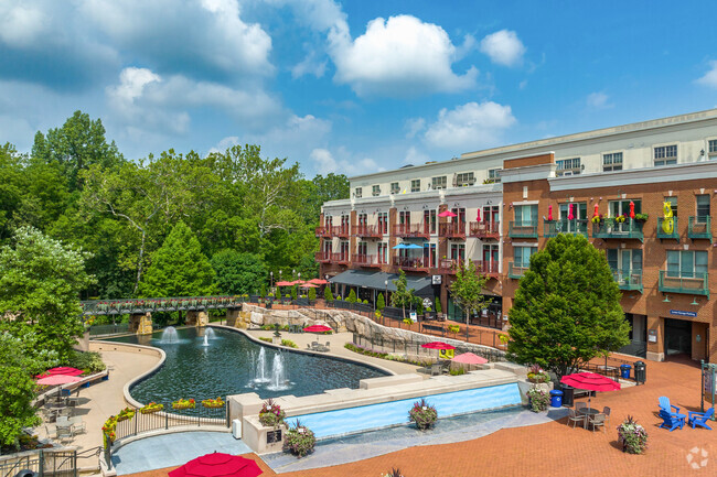 Creekside Plaza in Gahanna, Ohio is a waterfront area featuring a walking path, shops, restaurants, paddle boats, and a fountain.