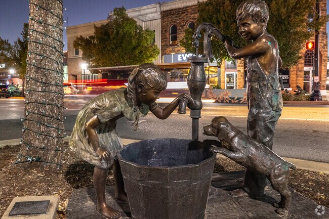 The popular "Puppy Love" statue along South Broadway in Edmond designed by Marianne Caroselli.