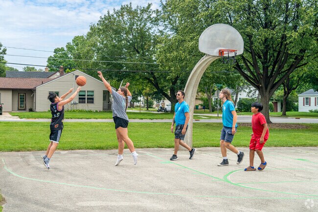 Friends play a quick game of basketball at Marquette Park in Green Bay, WI.