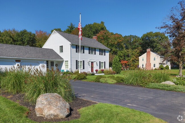 Rows of homes on Howlett Street have lush lawns in Topsfield.