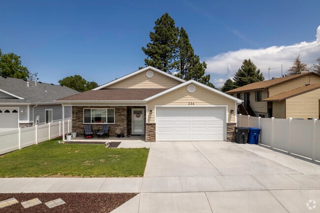 A charming home with beige stone detail in Washington Terrace.