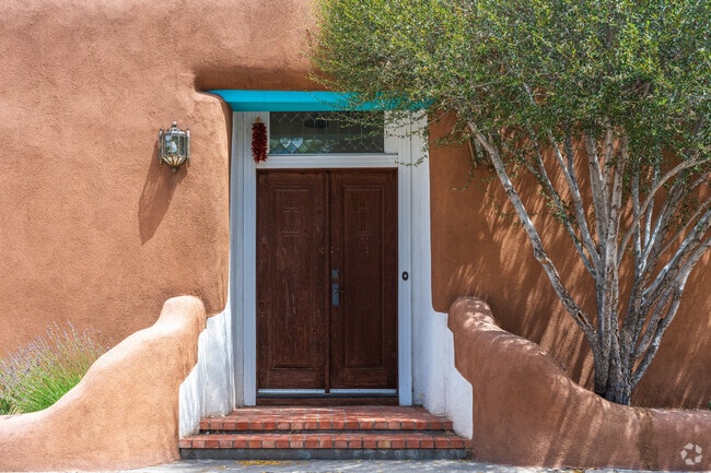 Wooden, hand-carved doors and chile ristras adorn the exterior of many homes in Santa Fe.